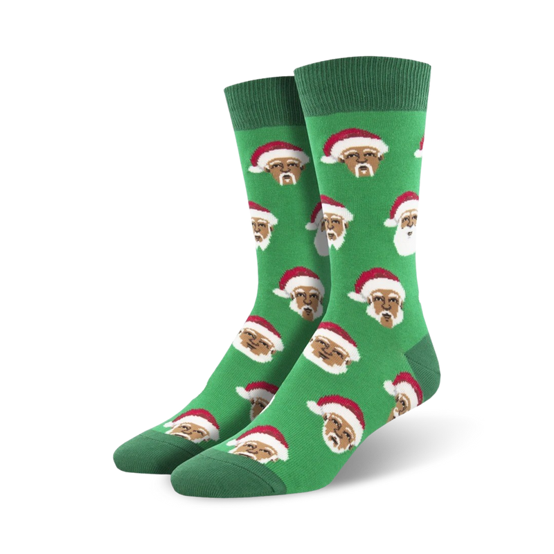 Pair of crew socks, green and white, featuring a repeating pattern of a Black Santa Claus wearing a red hat.