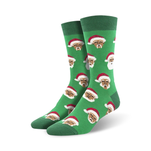 Pair of crew socks, green and white, featuring a repeating pattern of a Black Santa Claus wearing a red hat.