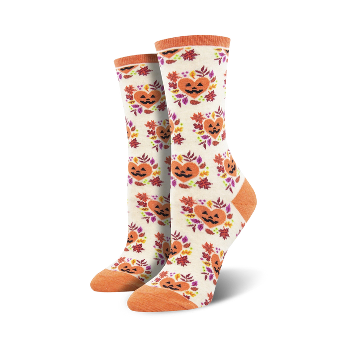 Cream crew socks with orange jack-o'-lantern faces in autumn leaf wreaths.