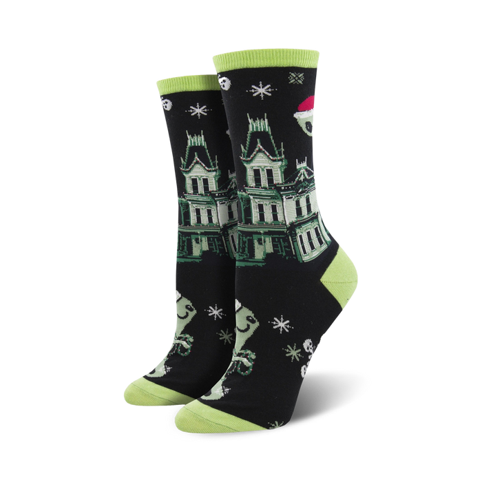 A pair of black crew socks with a green haunted house, ghosts wearing Santa hats, and snowflakes. Lime green cuffs. }}