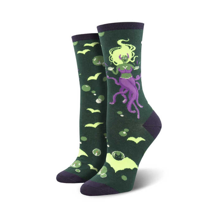 Crew socks in dark green with a whimsical illustration of a purple octopus mermaid, bats, and bubbles.  Lime green accents add to the spooky fun design. }}