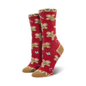 Lifestyle shot showing the red version of the Goodie Gumdrop socks, with the same gingerbread men and candy cane design.