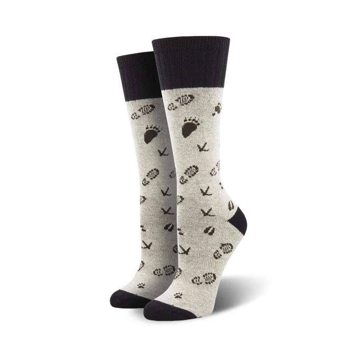 gray wool crew socks with black cuff and brown footprint and bird track pattern.  