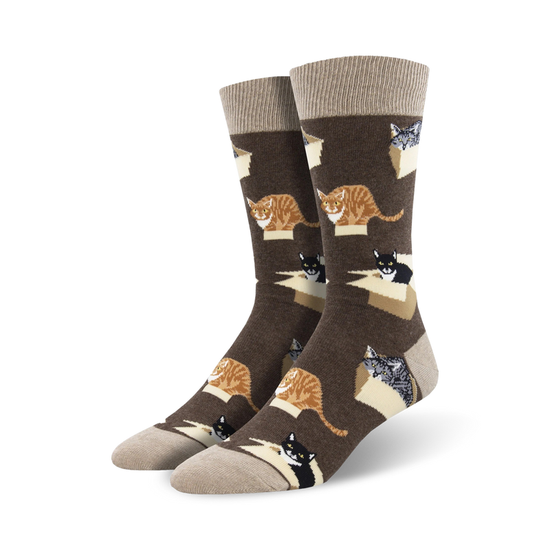 Pair of brown crew socks with a repeating pattern of cats in cardboard boxes. The cats are orange, black, and gray.
