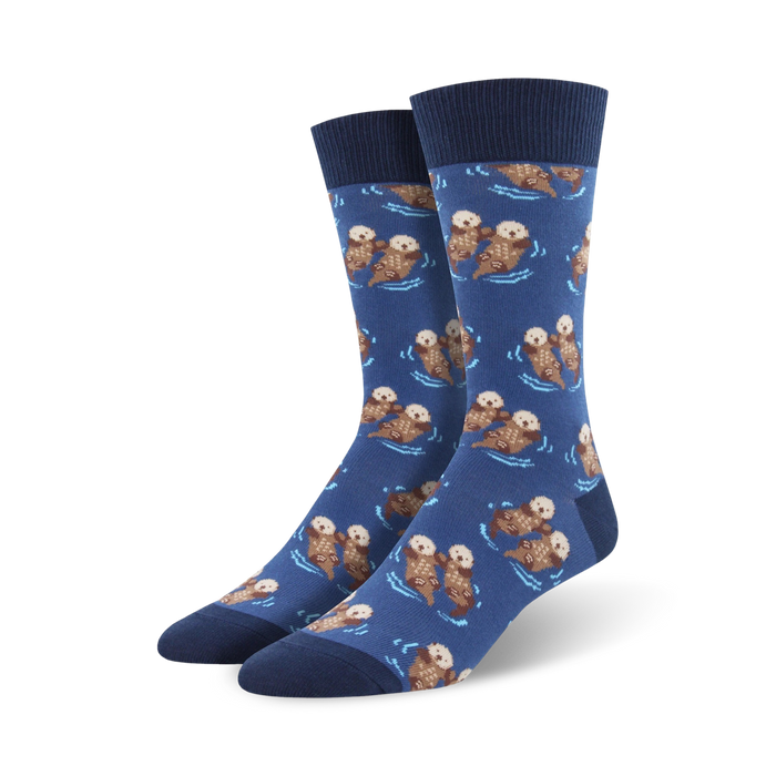 dark blue crew length socks with cute cartoon otters swimming and holding hands on a blue-green water wavy background. wonderful for men.    }}