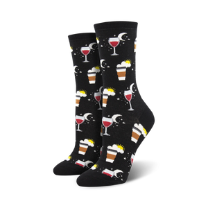 Pair of crew socks in black and blue, featuring a whimsical design of coffee cups, wine glasses, suns, and moons.