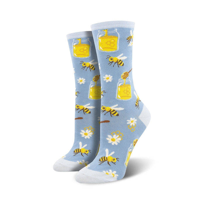 blue crew socks for women featuring a vibrant bee, honey jar, and white flower pattern.   