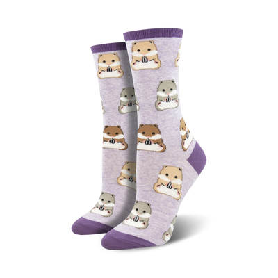 Pair of women's crew socks. Lavender background with repeating pattern of brown, beige and grey hamsters holding sunflower seeds. Purple cuffs.