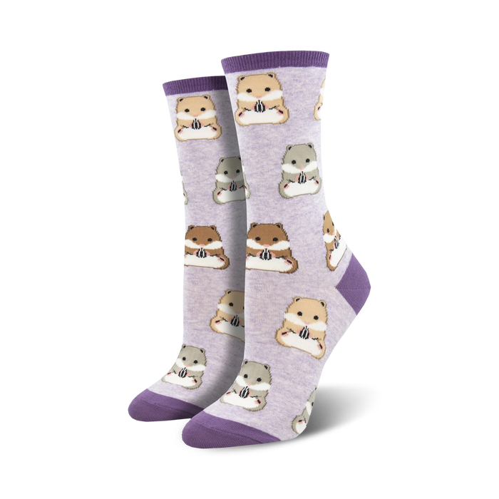 Pair of women's crew socks. Lavender background with repeating pattern of brown, beige and grey hamsters holding sunflower seeds. Purple cuffs.