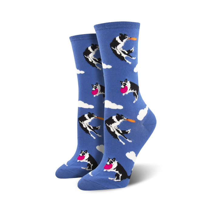 Pair of women's crew socks. Blue background with repeating pattern of black and white border collies catching pink and orange frisbees.