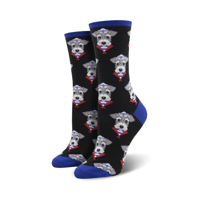 Pair of black crew socks with a repeating pattern of miniature schnauzers wearing sailor hats.  The socks have royal blue cuffs.