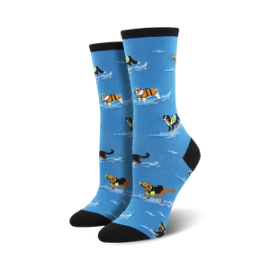 Pair of women's crew socks. Light blue background, dogs surfing in life vests, black and cream colored cuffs.