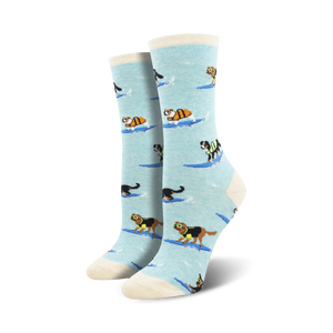 Lifestyle shot of a woman wearing the light blue surfing dogs socks. Shows the socks on feet with jeans.