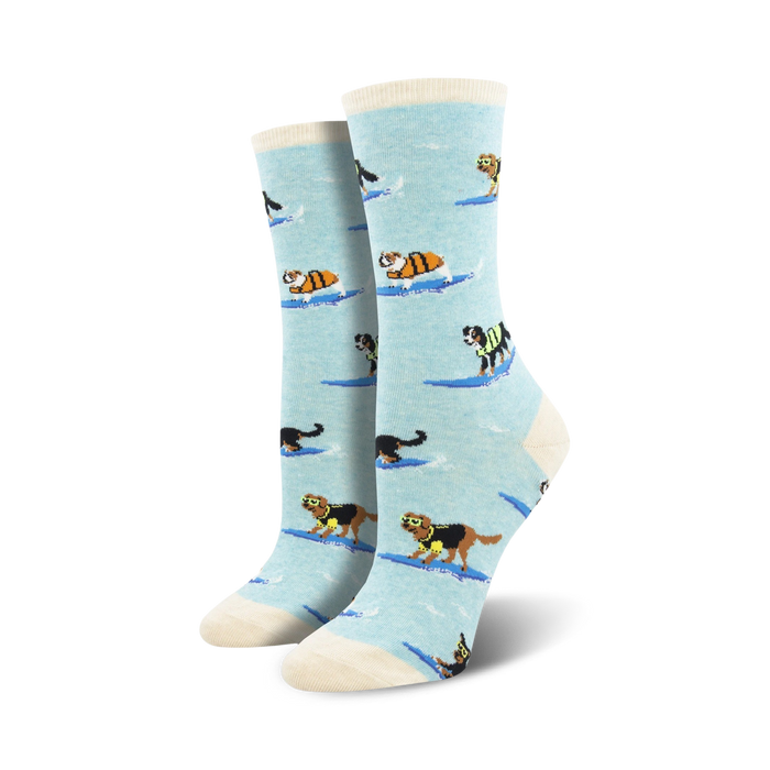 Lifestyle shot of a woman wearing the light blue surfing dogs socks. Shows the socks on feet with jeans.