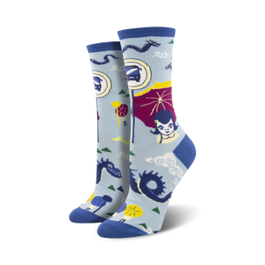 Women's crew socks in light blue and teal, featuring an illustrated bus stop scene with dragons, parasols, and a girl.  Fun and quirky design!