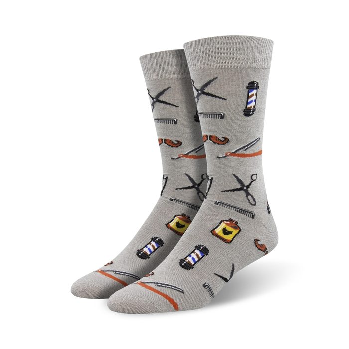Pair of grey bamboo crew socks with a fun pattern of barber tools like scissors, combs, razors, and a barbershop pole. }}