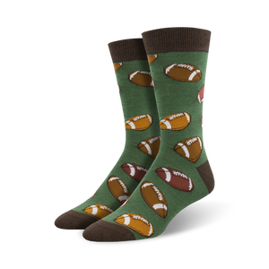 Pair of green crew socks with brown football designs. Brown cuff.  Fun, casual style.