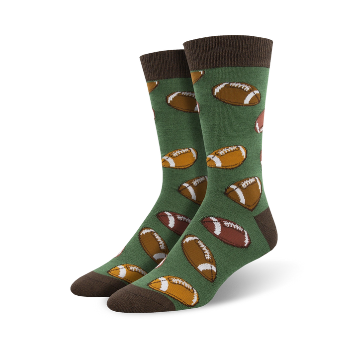 mens hut hut hike bamboo socks with pattern of brown footballs on field of green    }}