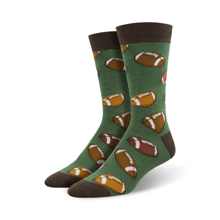 Pair of green crew socks with brown football designs. Brown cuff.  Fun, casual style.