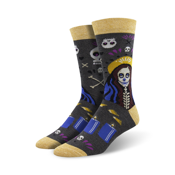 A pair of crew socks in dark grey with a Day of the Dead themed design. The main image shows a woman with sugar skull makeup, candles, and skulls. }}