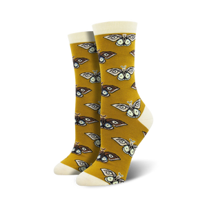 Pair of women's crew socks. Mustard yellow background with repeating brown and cream moth pattern.  Soft bamboo fabric.