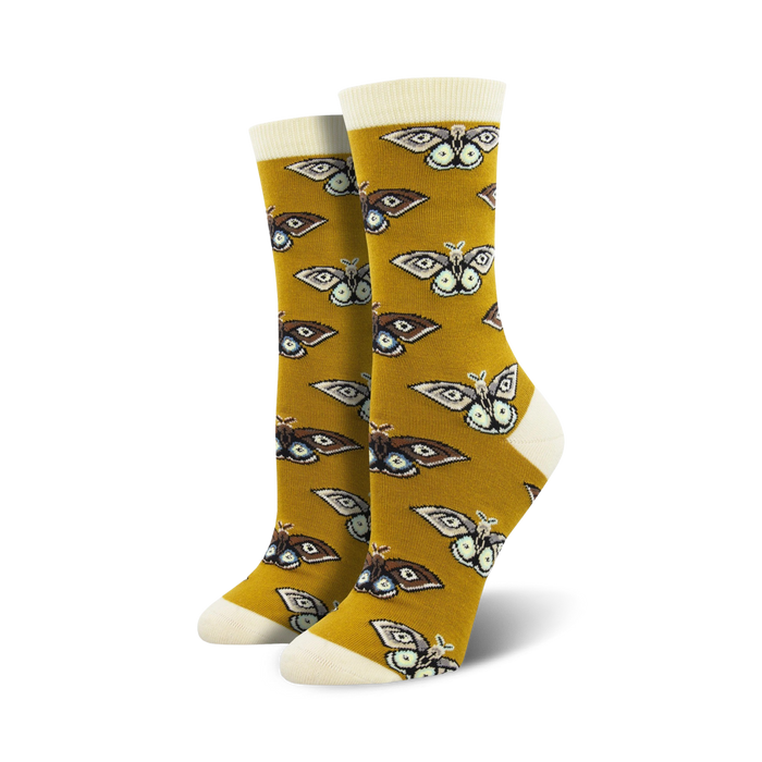 mustard yellow crew socks with a pattern of brown, black, and white moths with yellow and blue details  
