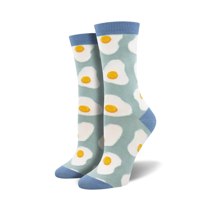 Pair of crew socks with a sunny-side-up egg pattern. Light blue background, white eggs with yellow yolks. Blue cuffs. }}