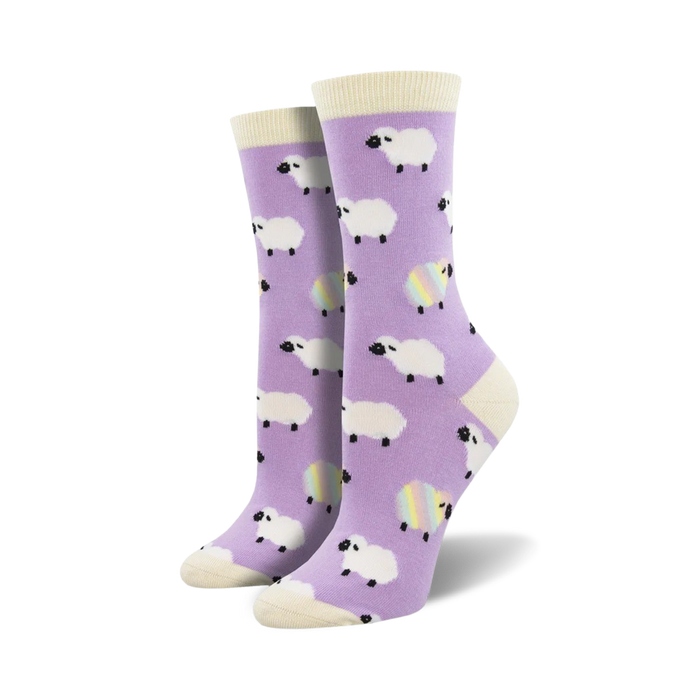 Pair of lavender crew socks with a whimsical pattern of white sheep and rainbow sheep accents.  Off-white cuff.