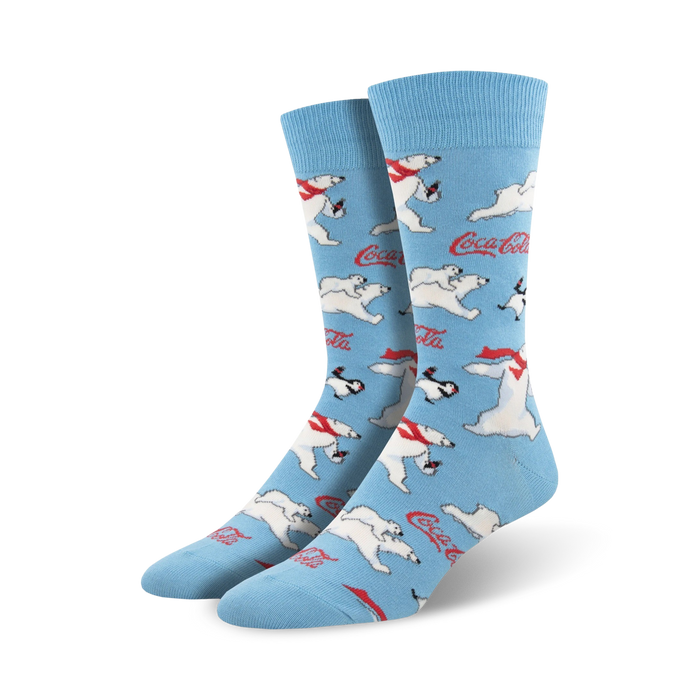 A pair of crew socks in light blue featuring a repeating pattern of polar bears, penguins, and Coca-Cola logos. }}