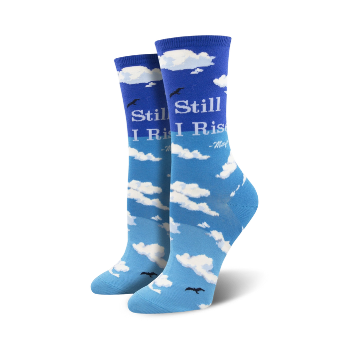 Pair of crew socks in shades of blue, featuring a sky and clouds design with Maya Angelou's 'Still I Rise' quote. }}