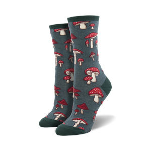 Pair of crew socks with a whimsical mushroom pattern. The socks are teal and feature red and white mushrooms.