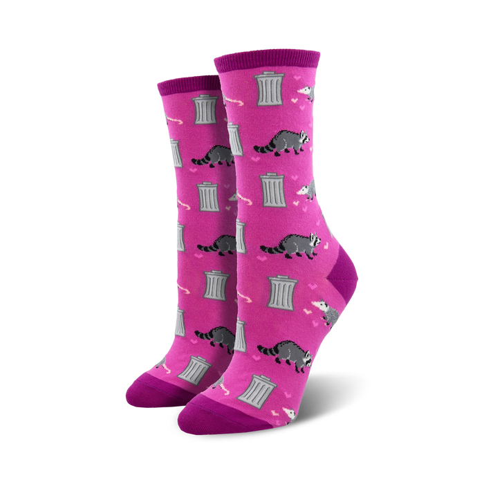 Pair of women's crew socks. Pink background with gray raccoons, hearts, and dumpsters.