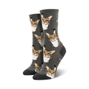 gray crew socks with a pattern of cartoon cat faces and the word 