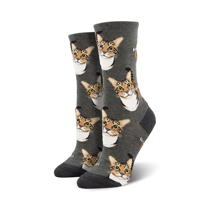 gray crew socks with a pattern of cartoon cat faces and the word 