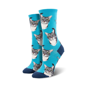crew length women's boop socks in blue feature a fun pattern of cartoon cat faces with gray fur and black noses.  