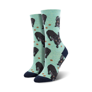 Pair of mint green crew socks with black French Bulldogs and brown paw prints; navy blue heel and toe.