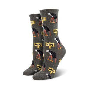 Close-up of grey 'Nope' socks showcasing the detail of the ostrich and sign design.