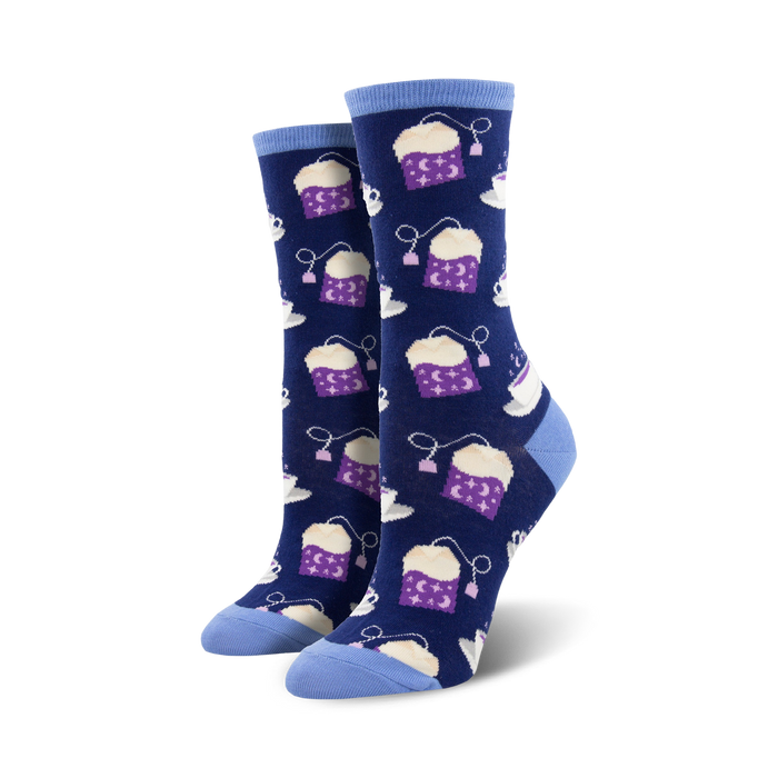 Pair of women's crew socks. Navy blue background with purple tea bags and cups. Stars and moon details on tea bags. }}