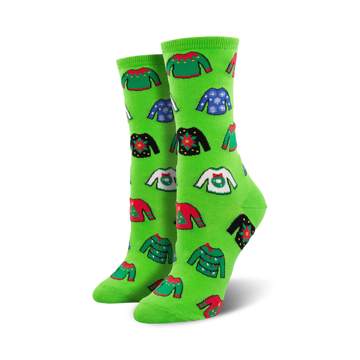 Pair of crew socks in bright green and red, featuring a whimsical all-over print of various holiday-themed ugly sweaters.