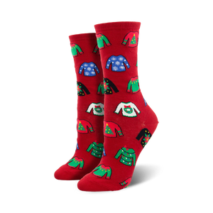 Close-up showing the detail of the colorful ugly Christmas sweater patterns on the red socks.