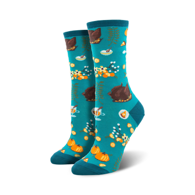 Pair of teal crew socks with a Thanksgiving-themed pattern: roasted turkeys, pumpkins, pie, and fall foliage.