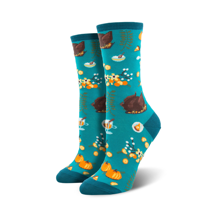 women's crew socks with turkey, pumpkin, pie, and flower patterns on blue background for a fun thanksgiving look. 