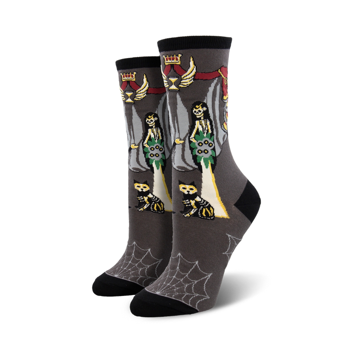 Gray crew socks with Catrina skeleton brides, skeletal cats, and a spiderweb pattern at the bottom.  Red, green, and yellow accents. }}