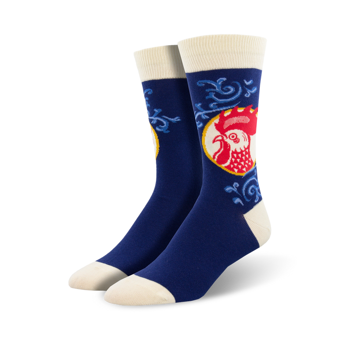blue crew socks feature a red rooster with white toe and ankle details.   