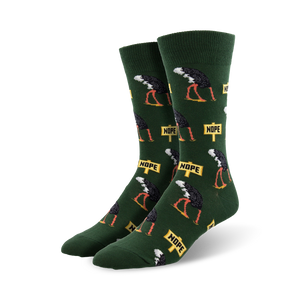 Pair of crew socks in green and gray featuring a repeating pattern of ostriches with 'Nope' signs. Fun, quirky design.