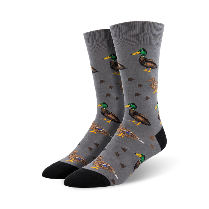 Gray crew socks with a repeating pattern of brown and green mallard ducks. A fun, quirky design. }}