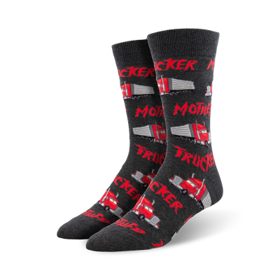 Pair of dark grey crew socks featuring red semi-trucks and the text 'Mother Trucker' repeated across the design.