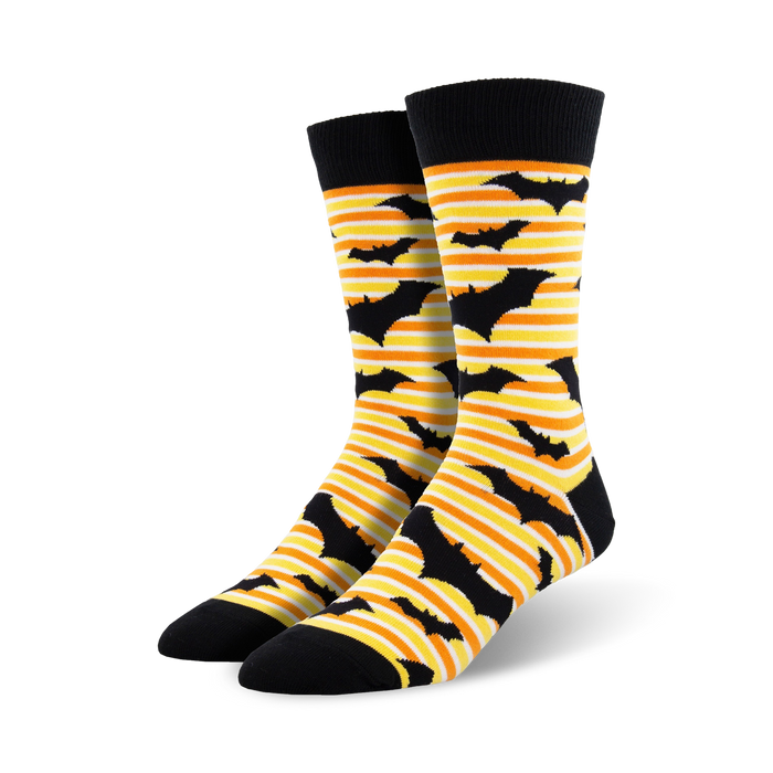 Pair of crew socks with black bats on orange and white stripes.  Black cuff. Fun Halloween design! }}