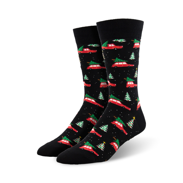 A pair of black crew socks with a pattern of red cars carrying Christmas trees and small green trees. Festive and fun! }}