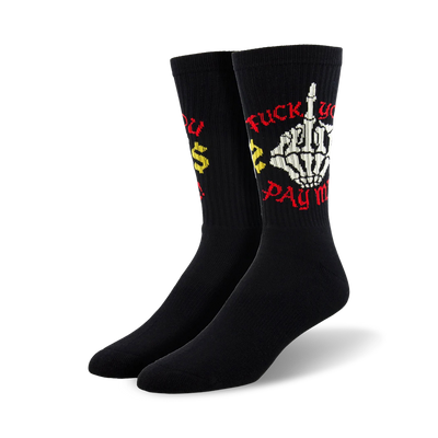 Pair of black crew socks featuring a skeleton giving the middle finger and the phrase 'Fuck You. Pay Me!' in red and yellow.